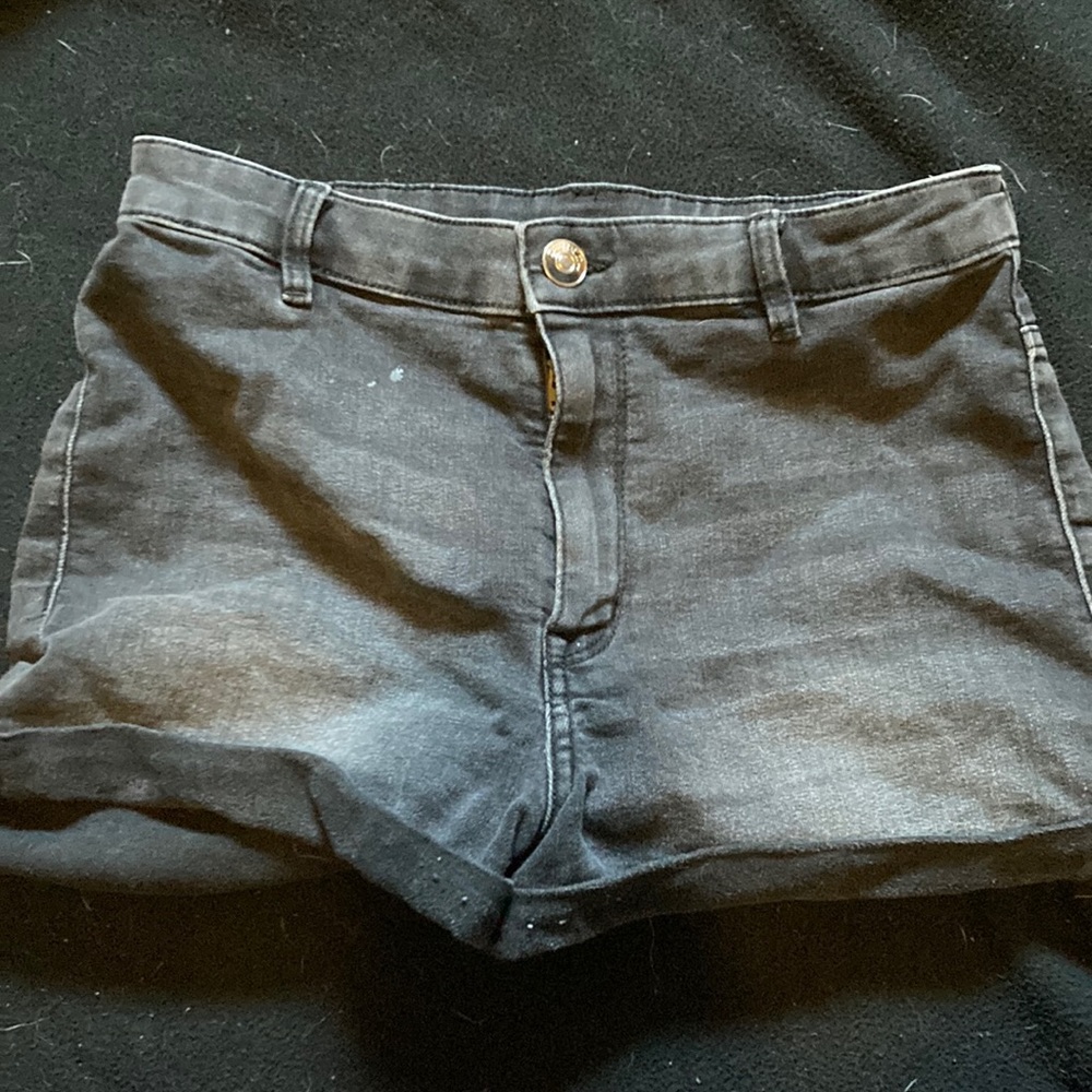 black worn jean shorts.
